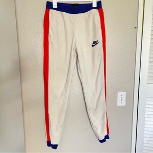 Nike Kids White and Red Joggers with Blue Accents
